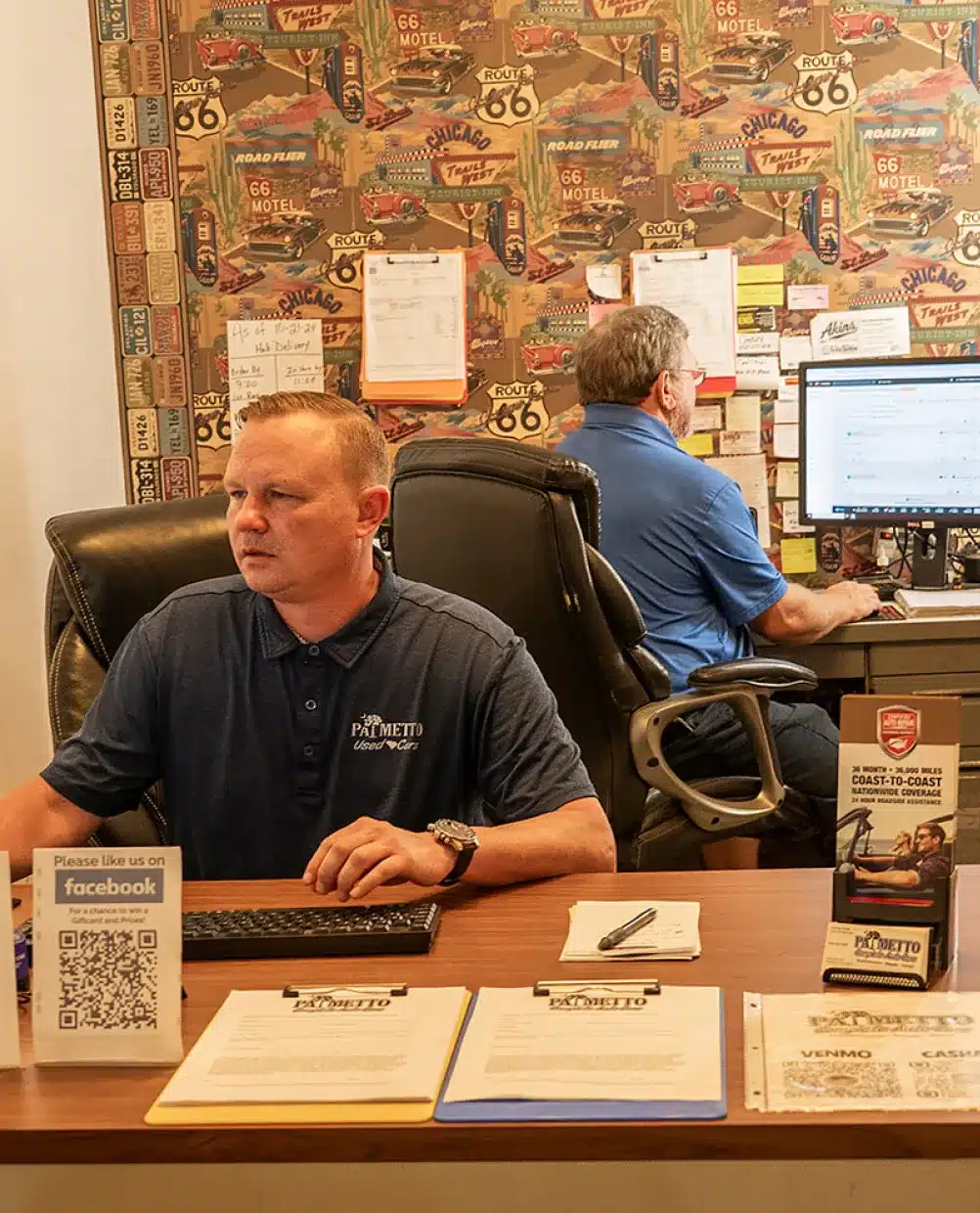 an image showing Auto repair financing options in Piedmont, SC to make car service affordable represented by 2 team members of the auto repair shop inside the office.