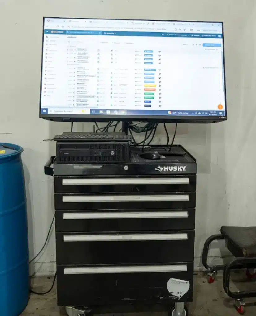 An image showing the digital vehicle inspections software and set-up in an auto repair shop. Comprehensive vehicle inspection services in Piedmont, SC