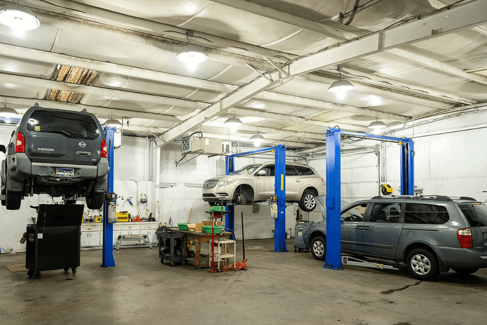 Car maintenance, auto repair in Piedmont, SC by Palmetto Complete Auto Care. Image of multiple vehicles on lifts, highlighting comprehensive diagnostics, routine maintenance, and efficient, high-quality automotive service for a wide range of vehicles.