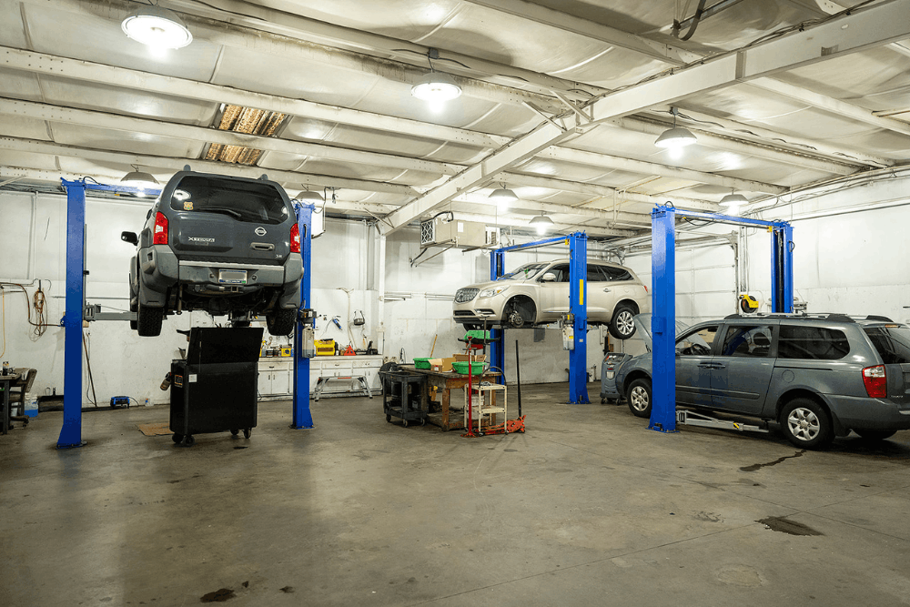 Auto repair in Piedmont, SC, at Palmetto Complete Auto Care. Image of multiple vehicles being serviced on lifts inside the repair shop, showcasing expert auto repair, diagnostics, and maintenance focused on reliable performance and long-term vehicle safety.